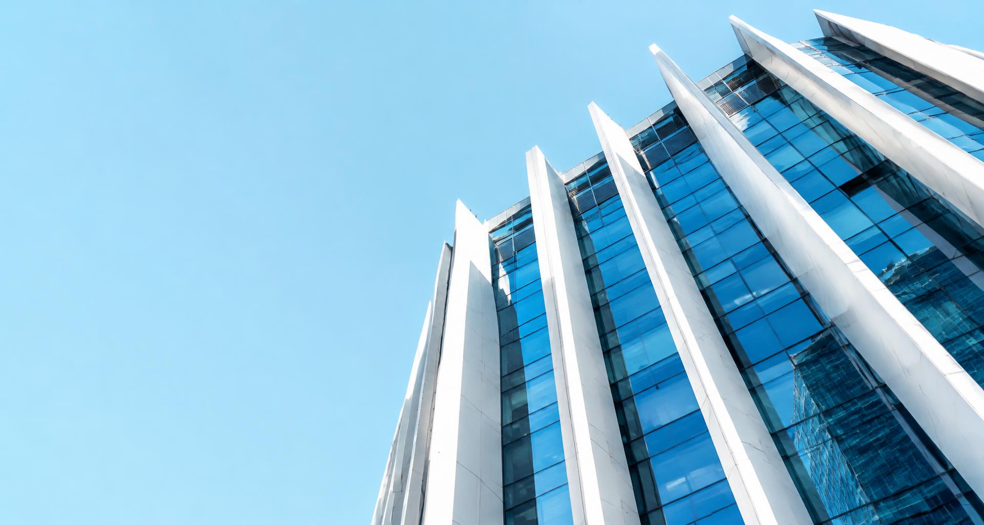 Modern white architectural fins rising alongside a blue glass building